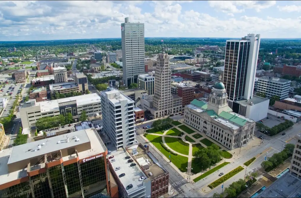 Luxury limo service from Chicago to Fort Wayne featuring a sleek black stretch limousine traveling on a long highway, showcasing premium and comfortable long-distance transportation.