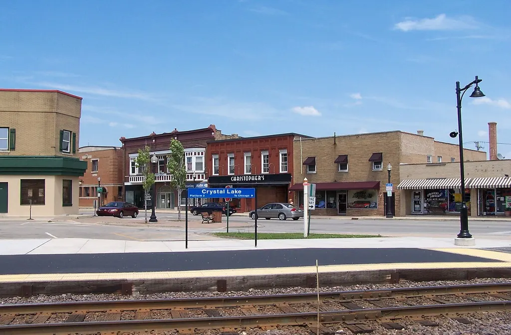Luxury limo service in Crystal Lake with a sleek black limousine parked on a clean city street, offering premium transportation.