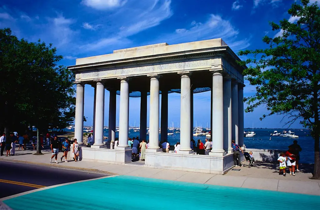 Luxury limo service in South Shore featuring a sleek black stretch limousine parked near a scenic lakeside urban area, showcasing premium transportation and elegance.