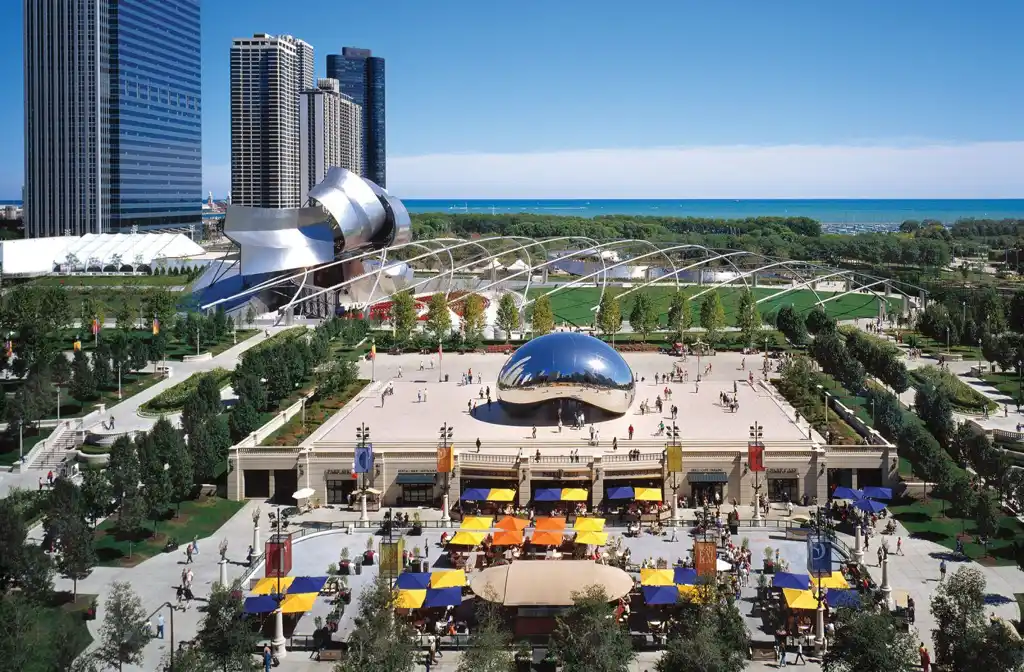 Luxury limo service to Millennium Park featuring a sleek black stretch limousine parked near iconic city landmarks, showcasing premium transportation and elegance in downtown Chicago.
