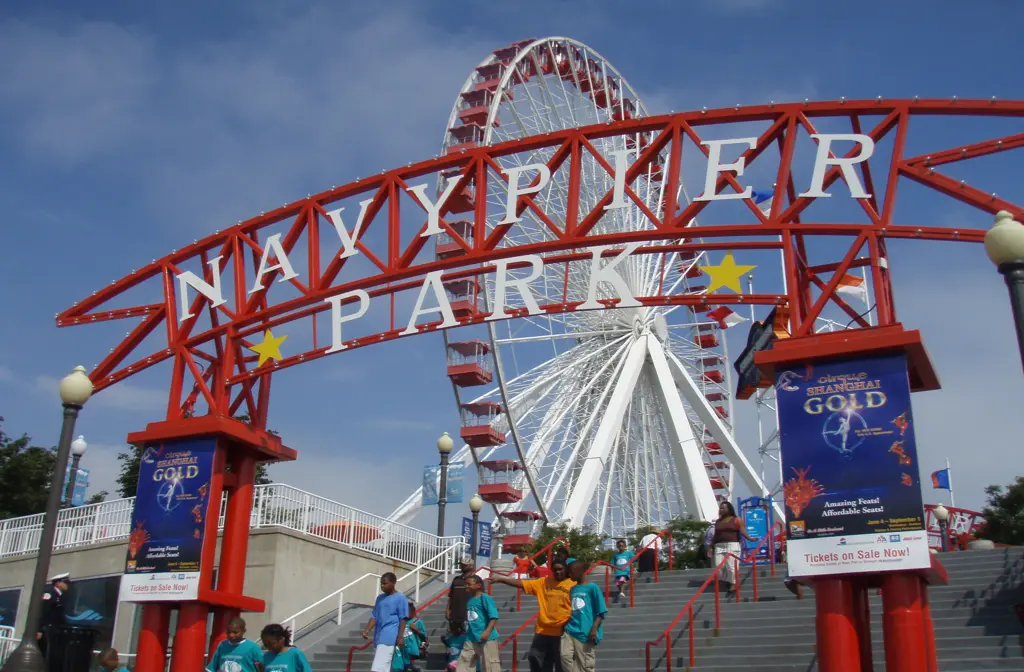 Luxury limo service to Navy Pier featuring a sleek black stretch limousine parked near the iconic waterfront attraction, showcasing premium transportation and elegance in Chicago.
