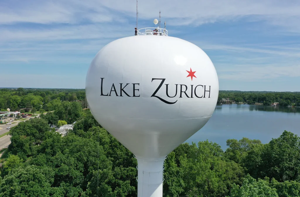 Premium limo service in Lake Zurich with a sleek black stretch limousine parked near a scenic lakeside area, showcasing luxury and comfortable transportation.