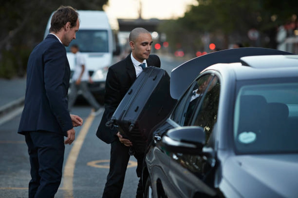 Airport Transportation Chicago service with professional chauffeur loading luggage for executive airport transfer.